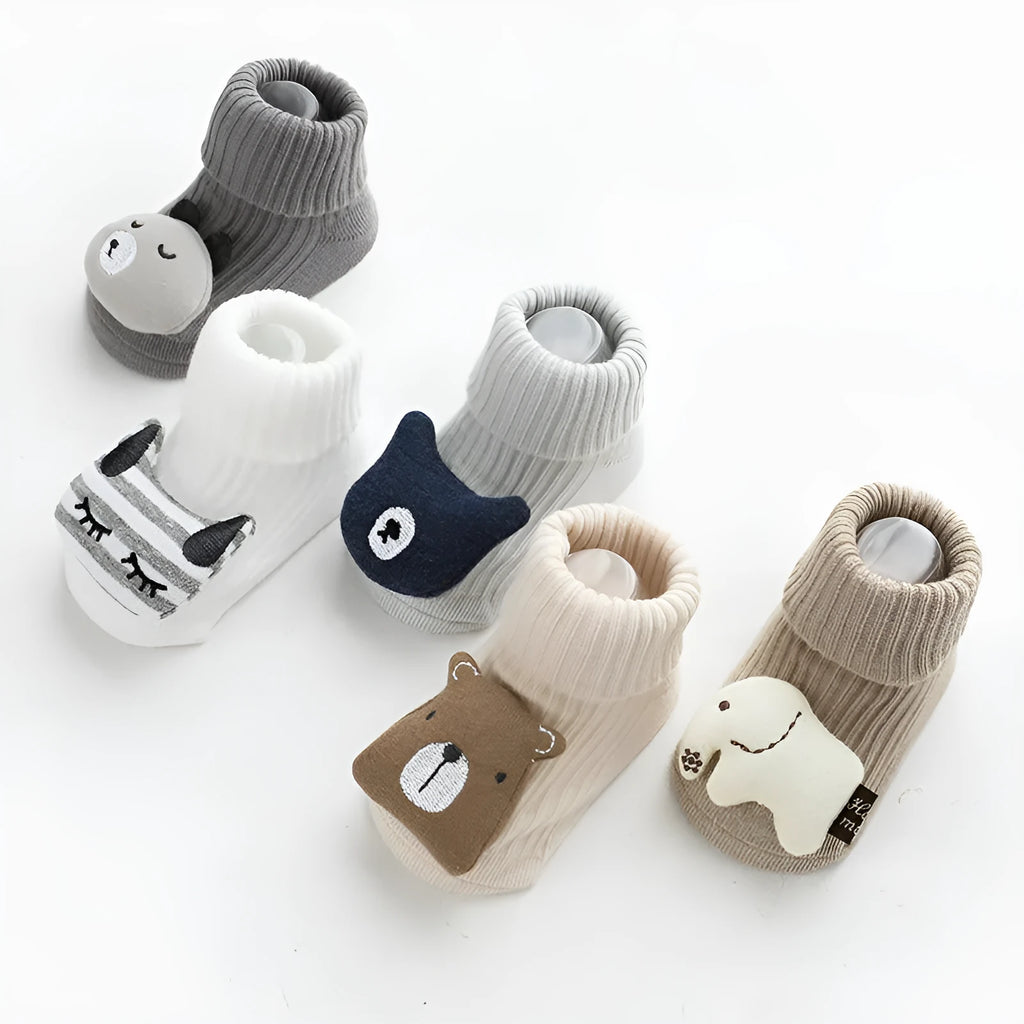 Baby socks with anti-slip glue dots on soles in combed cotton, showing mid-tube height and various colour options