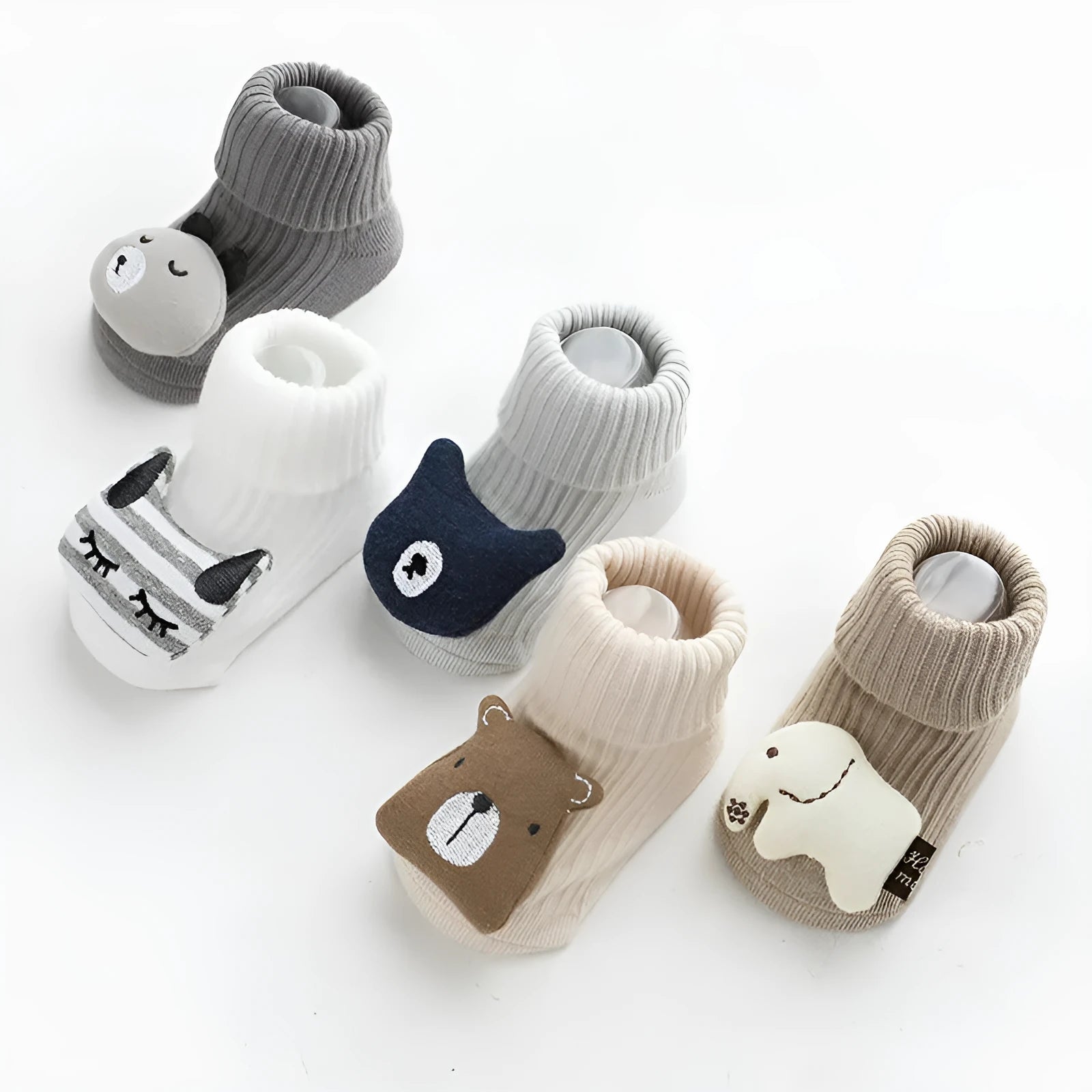 Baby socks with anti-slip glue dots on soles in combed cotton, showing mid-tube height and various colour options