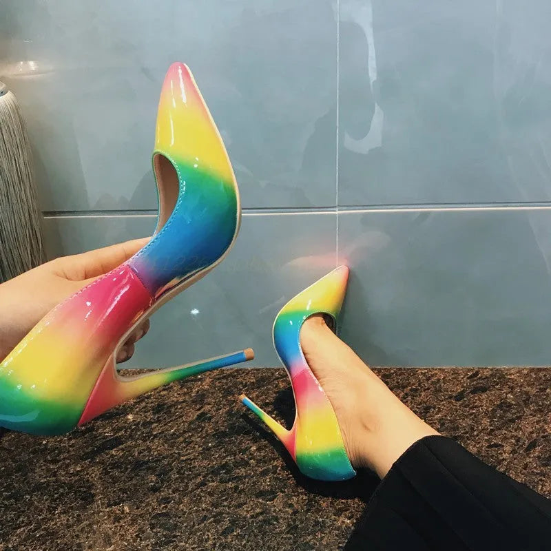 Rainbow multicolour patent leather women's stiletto heels with a pointed toe.
