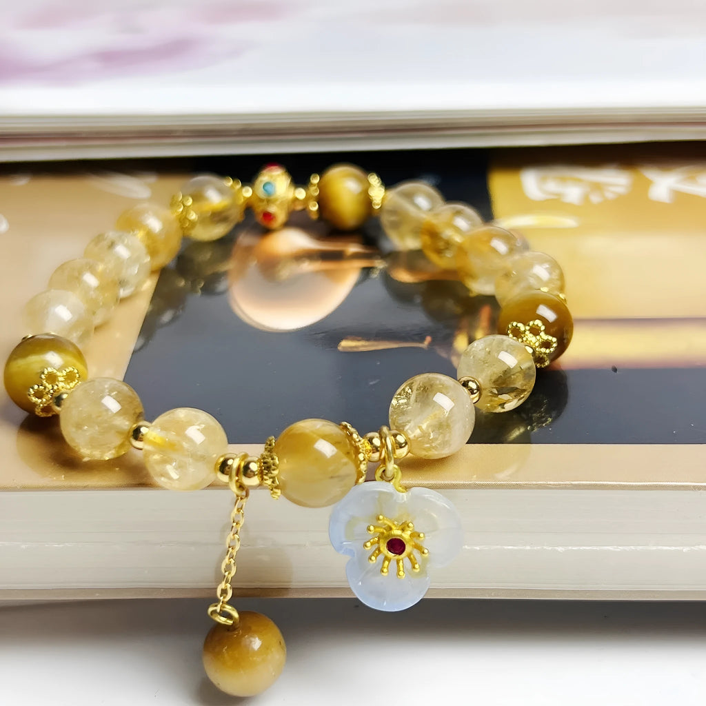 Women's citrine-coloured crystal bracelet with handcrafted flower tassel design