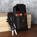 Men's brown leather phone hanging belt bag with car suture stitching showing cover opening and belt attachment
