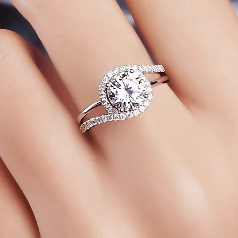 Diamond twist ring with small stones in white gold colour on copper base, adjustable opening