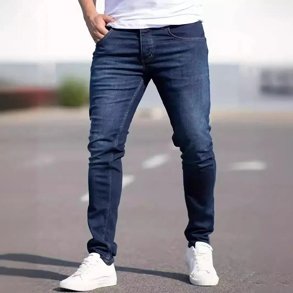 Men's dark blue skinny-fit casual jeans with a zip fly on a mid-waist.