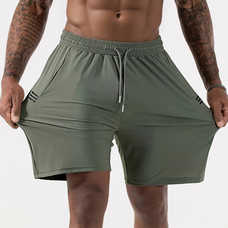 Man wearing black ice silk quick-drying sports shorts with drawstring waist.
