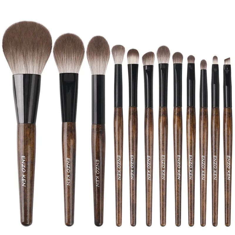 12-piece makeup brush set with wooden handles in a black PU travel case