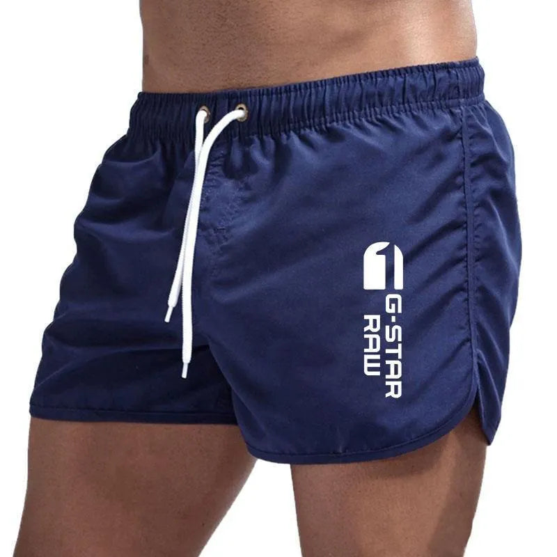 Men's thin hemp-blended polyester sport shorts in multiple colours on a mannequin, showing elastic waistband.