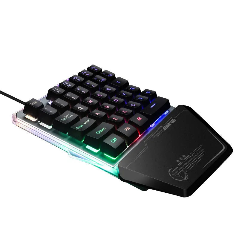 G40 Flow black one-handed robotic keyboard with RGB backlight on a desk.