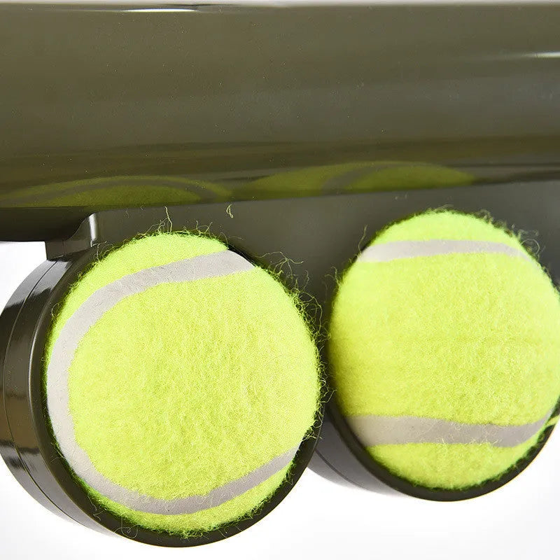 Black ABS plastic tennis ball launcher gun for dogs with two tennis balls