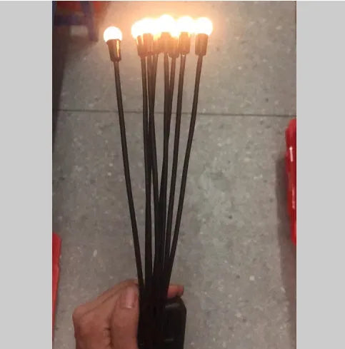 Solar-powered LED garden light with multiple heads on stainless steel ground spikes