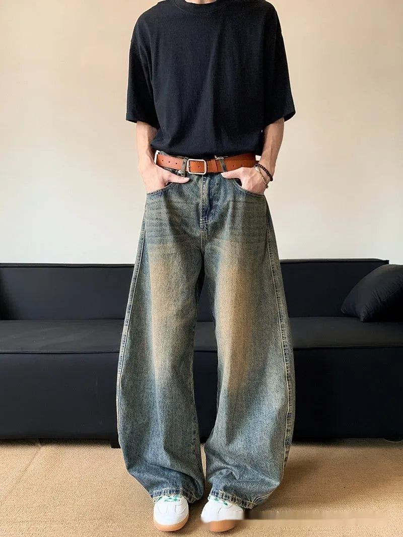 Men's retro blue distressed wide-leg denim jeans with micro-elastic fabric and zipper fly