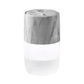 Mini USB jellyfish air humidifier in white with hollow ABS shell on desk