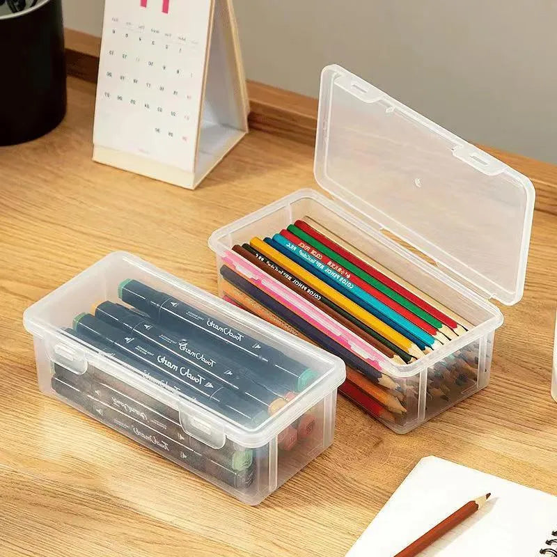 Clear plastic stationery storage box filled with assorted coloured pencils and crayons.