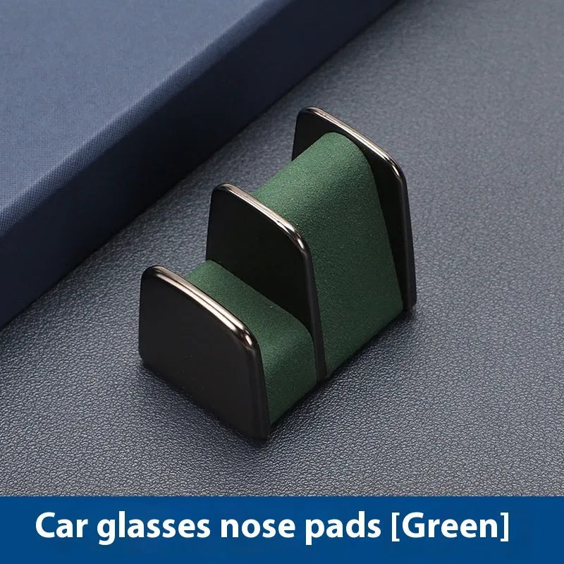 Zinc alloy and leather glasses clip for car dashboard in choice of colours.