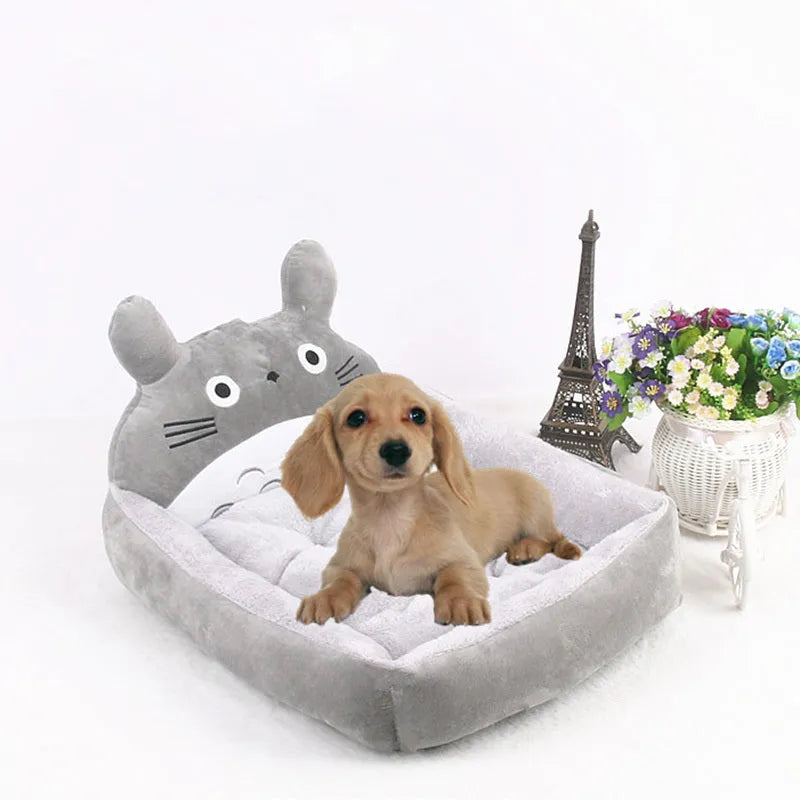 A cartoon-style soft plush sofa bed for a small dog or cat, shown in a grey colour.