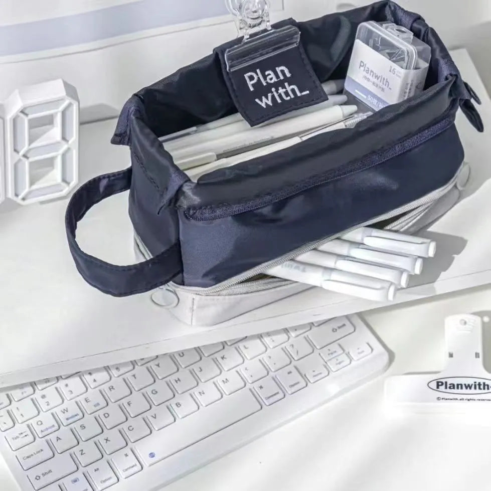 Foldable double-layer student pencil case in dark blue, blue, and cream white colours.