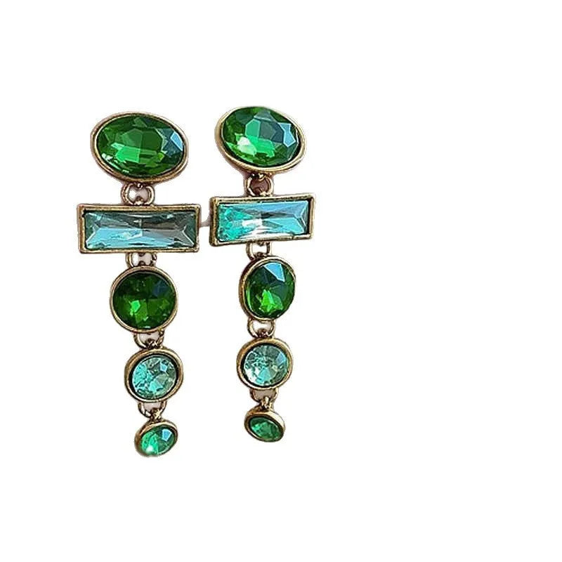 A pair of green gradient tassel earrings with a geometric shape and inlaid zircon detail.