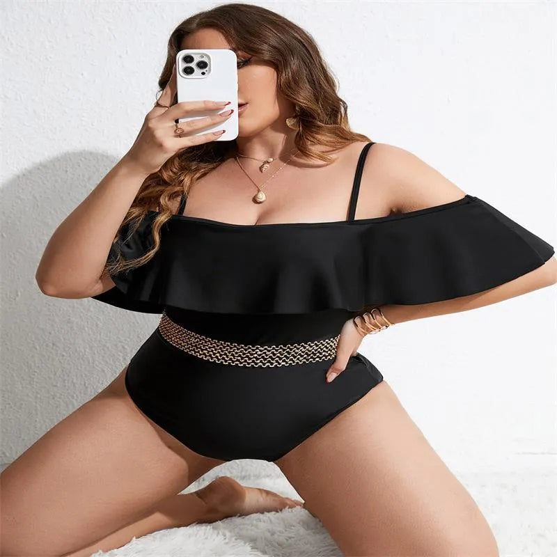Black solid colour one-piece swimsuit for women in plus sizes on a mannequin.