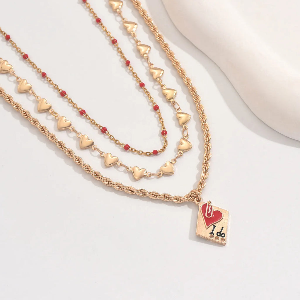 Three-layer geometric heart pendant on an adjustable zinc alloy clavicle necklace.