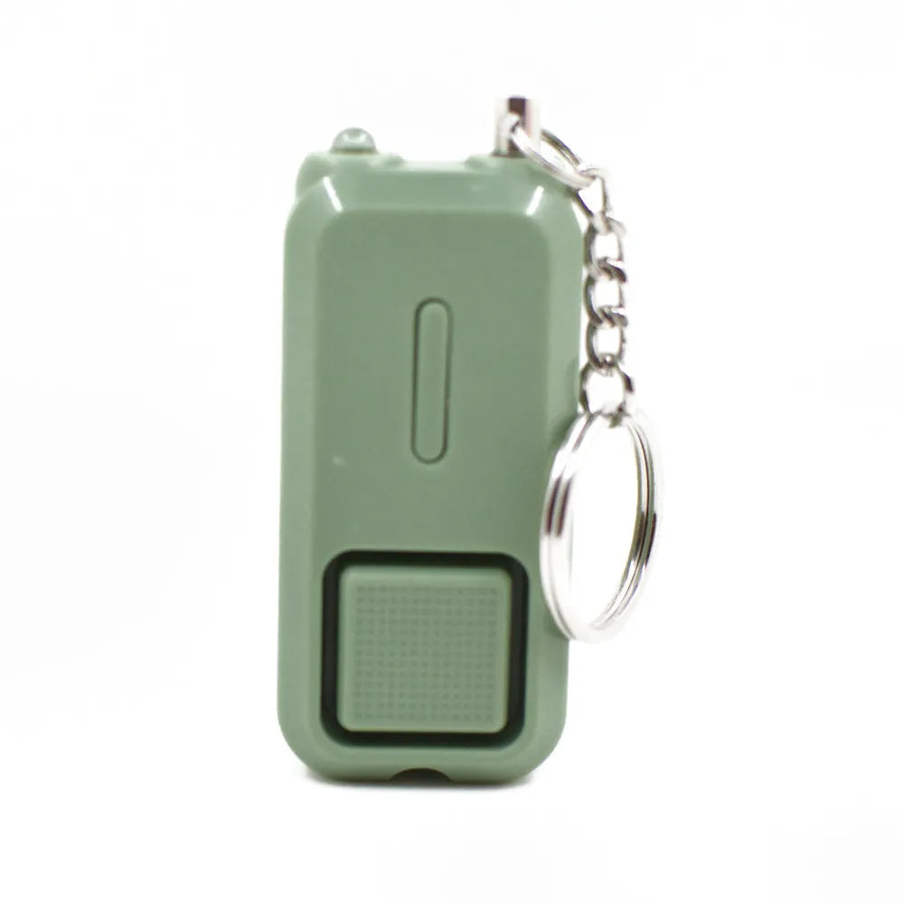 Pink personal safety alarm keychain with button, shown next to its white product box.