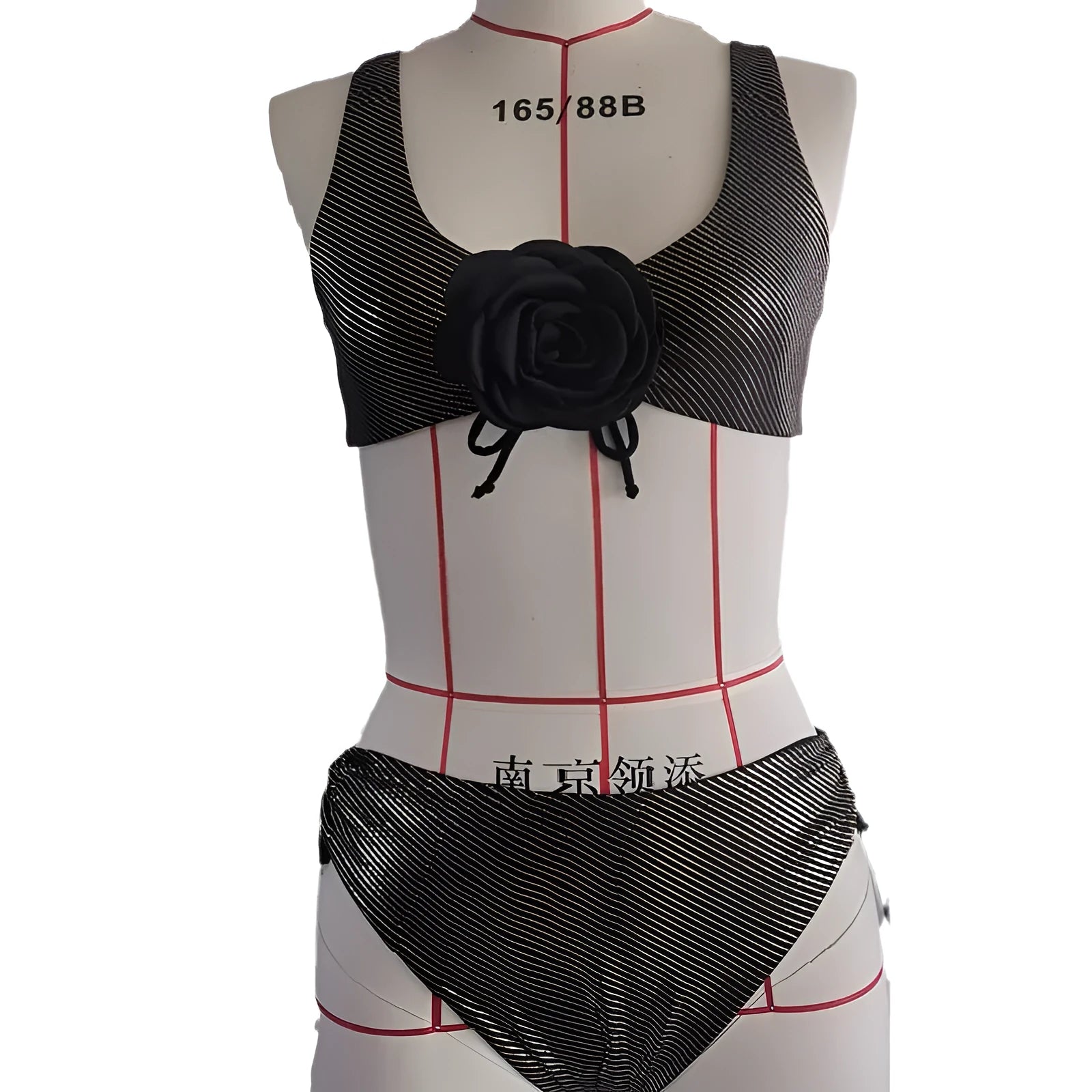 Black women's triangle swimsuit with 3D stereo design on a mannequin