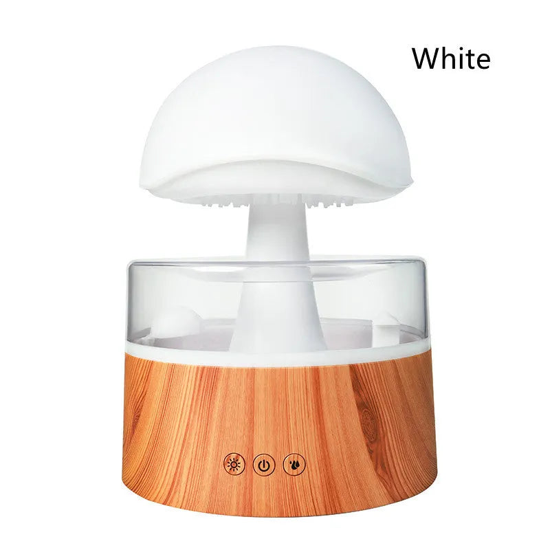 White cloud-shaped ultrasonic humidifier producing rainfall mist with colour-changing night light effects