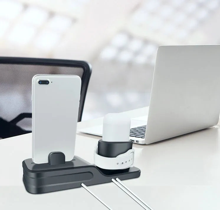 Black silicone 3-in-1 charging base for Apple-compatible iPhone, iWatch and AirPods devices on flat surface