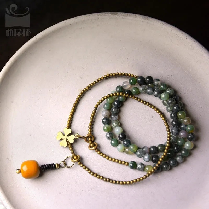 Handcrafted ethnic children's bracelet with natural crystal stones in multi-layered retro design