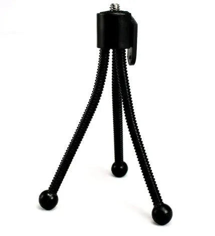 Small black iron frame mini tripod with extended legs and a universal ball head mount.
