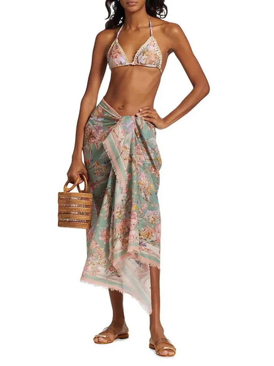 Women's creamy-white floral pattern bikini suit with matching skirt