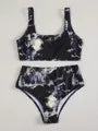 Women's high waist bikini set in a marble tie-dye print, showing U-neck top and briefs.