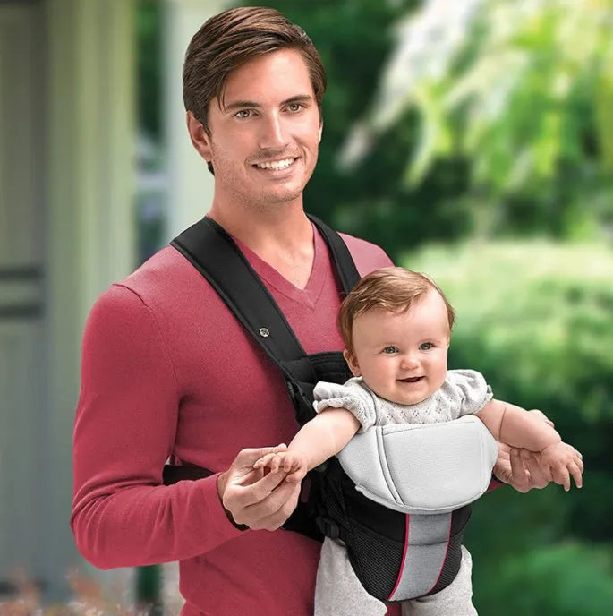 Double-shoulder baby carrier showing face-to-face carrying position with adjustable straps