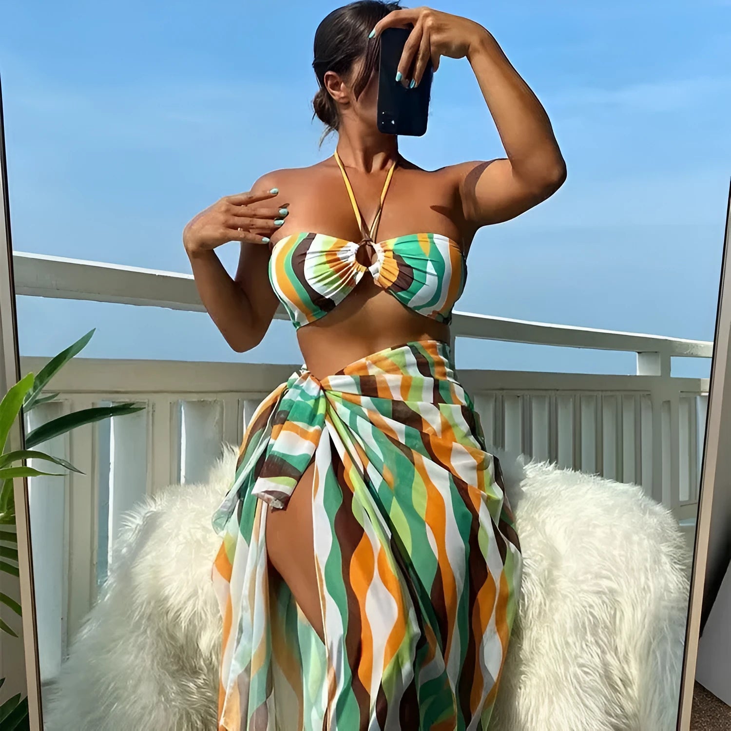 Women's printed beach bikini three-piece set with swimsuit top, briefs, and matching skirt in high-elasticity fabric