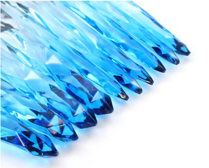10 clear crystal handle foundation brushes with diamond shanks, showing black, blue, red, and yellow colour options.