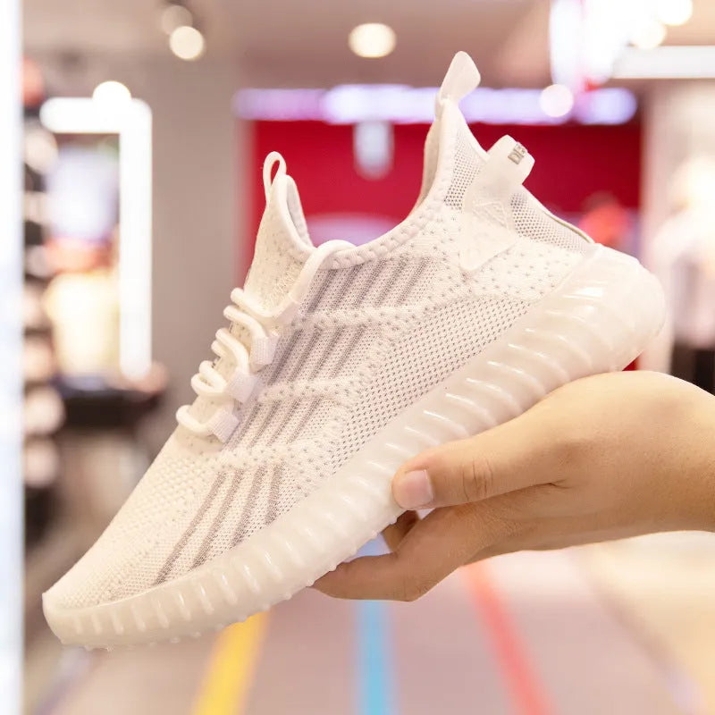 Men's white low-top sports shoes made of breathable flying fabric with mesh lining and a round toe.