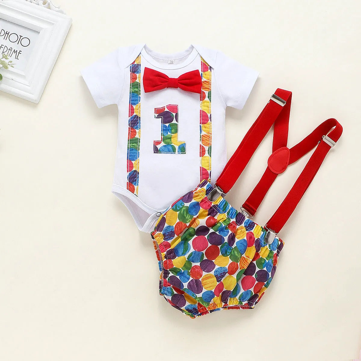 Cotton baby romper set with dinosaur print in blue or green, shorts length with ruffles and straps