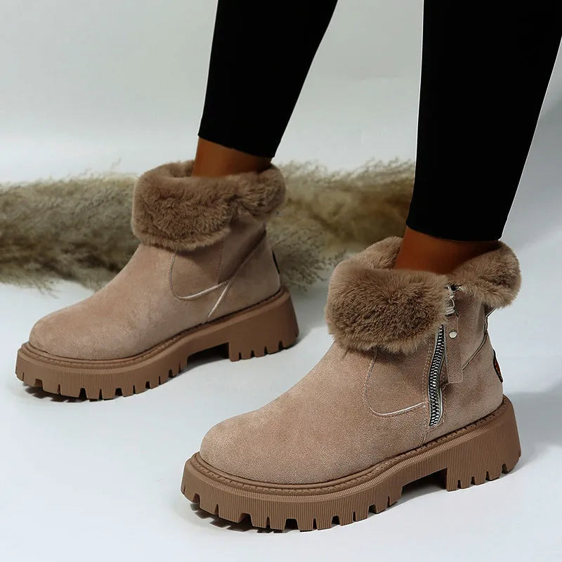 Women's black high-top faux suede snow boots with side zip and thick plush lining on a rubber sole.