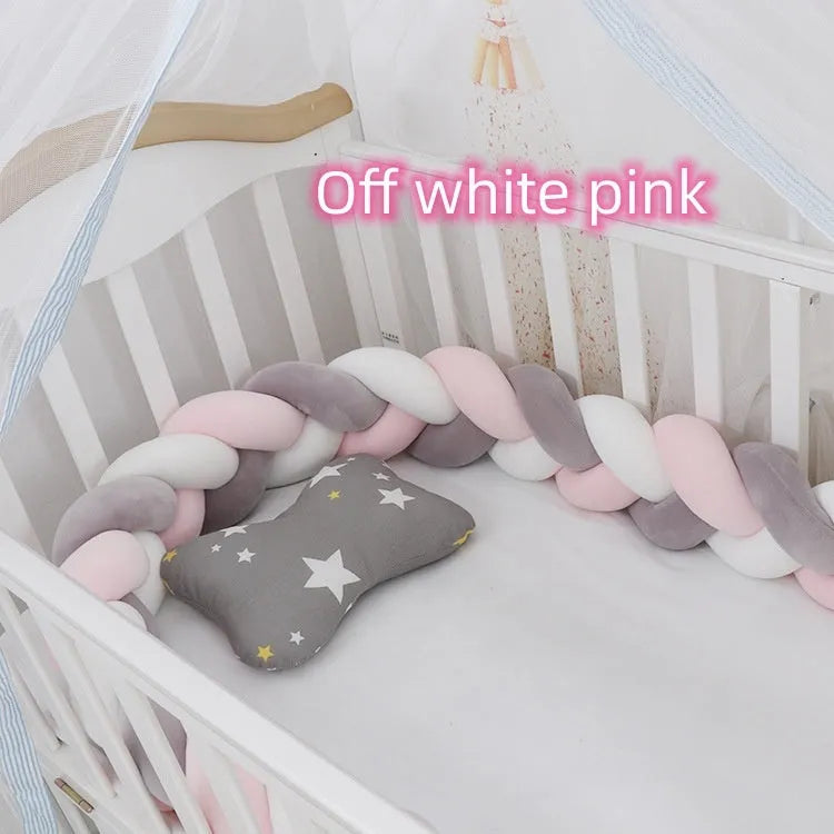 Baby crib bumper protector in spandex velvet, bent to show flexible shape, against a crib rail.