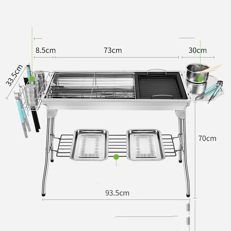 Stainless steel portable folding barbecue oven set up outdoors.