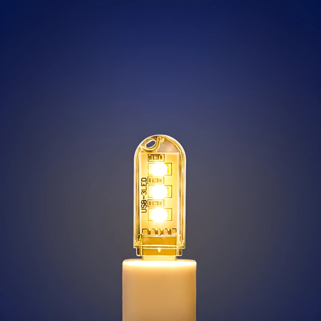 Compact white baby night light with USB cable showing dual colour options for nursery use