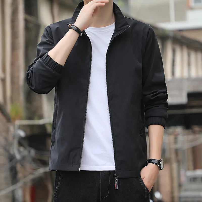 Men's Korean style loose lapel casual jacket in blue with zipper pockets.
