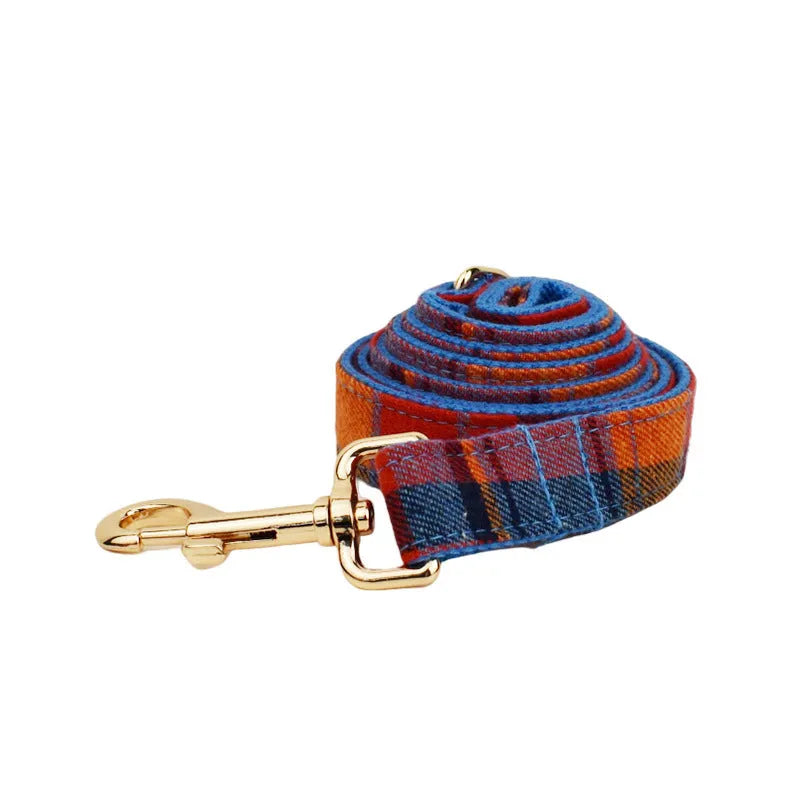 Four-piece dog accessory set with collar, leash, bow tie, and vest in cloth material