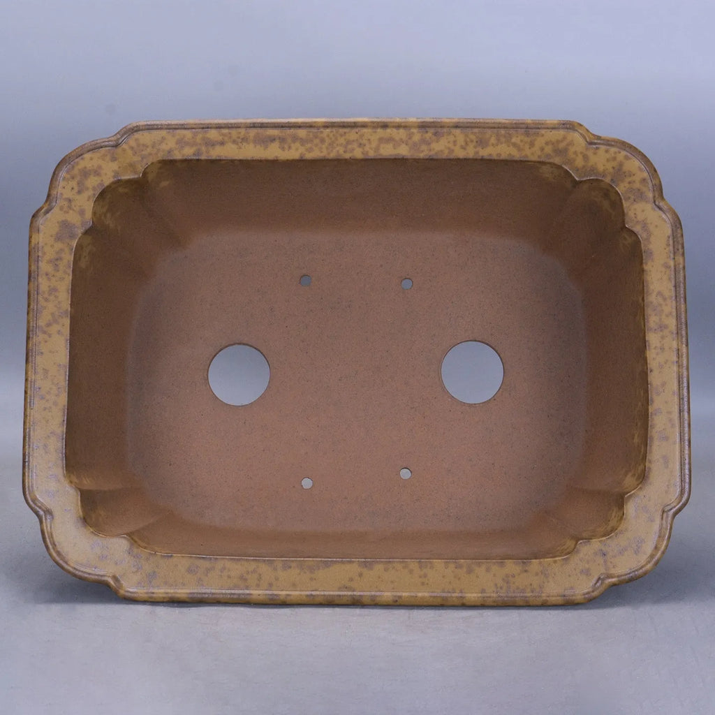 Large rectangular purple sand flowerpot with a double pumping angle design on a floor.