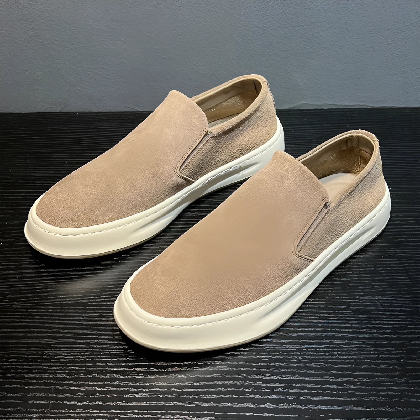 Men's grey casual shoes with round toe design and sewing line detailing showing rubber soles