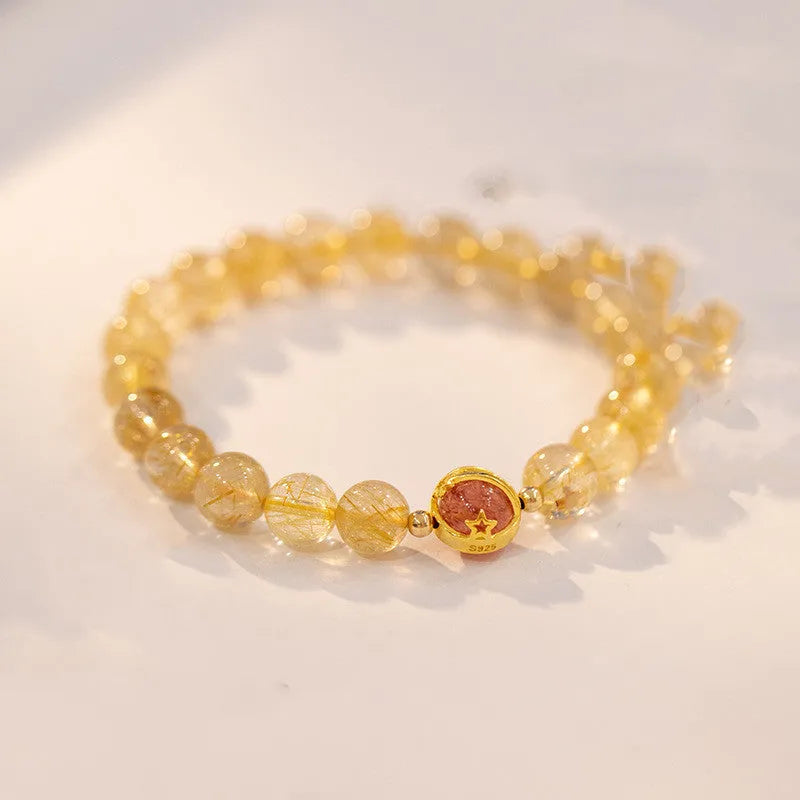 Gold rutilated quartz crystal bracelet with diamond-cut beads in 6mm and 8mm size options.