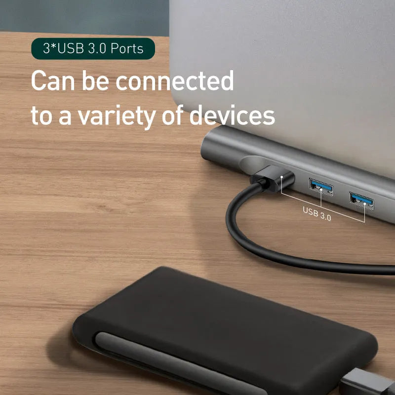 Grey aluminium ten-port docking station with cooling bracket showing HDMI, VGA, USB and network ports