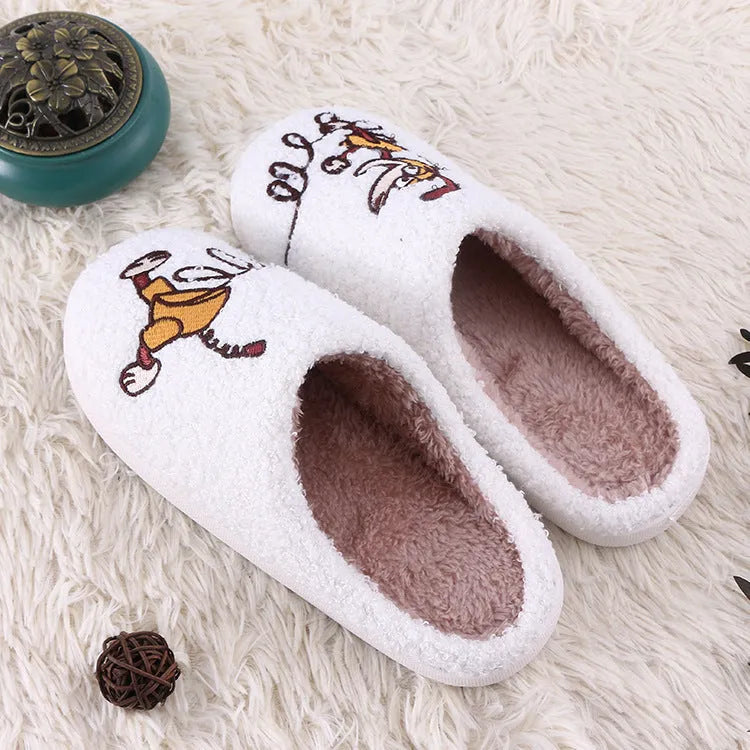 White fluffy slippers with cartoon patterns, rubber soles, and toe holder design