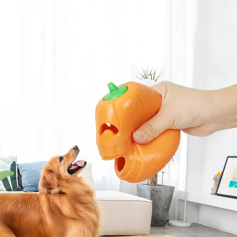 Halloween pumpkin shaped interactive dog chew toy with treat-dispensing funnel design
