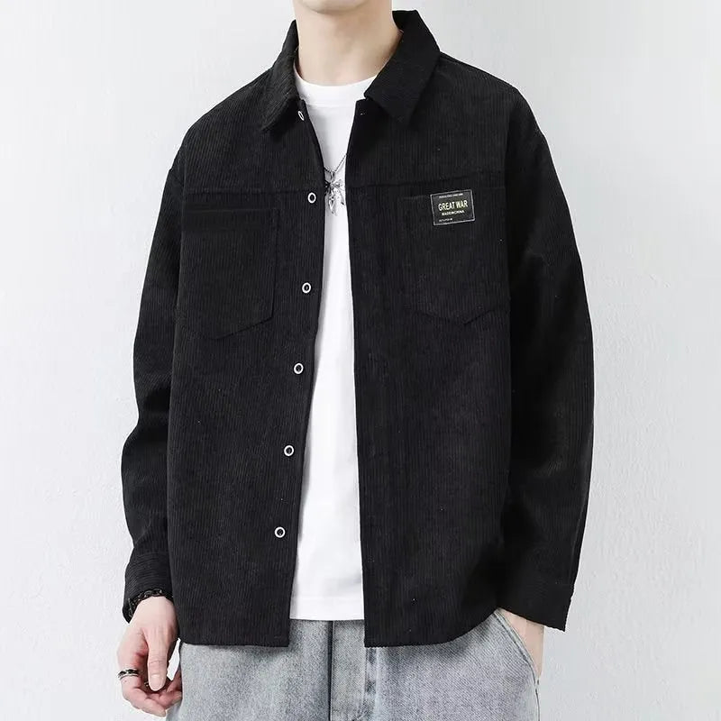 Men's black corduroy cardigan jacket with long sleeves on a hanger.