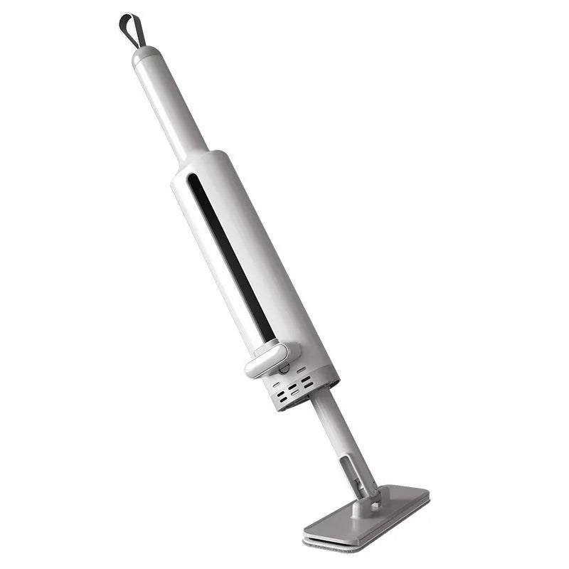 Pink rotatable self-squeeze flat mop with microfiber pad extended on a floor.