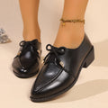 Women's pointed-toe PU slip-on shoe with a decorative bow on a rubber sole.